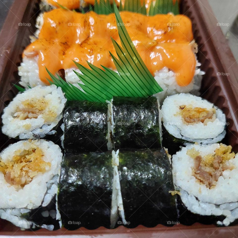 assorted sushi served in a container