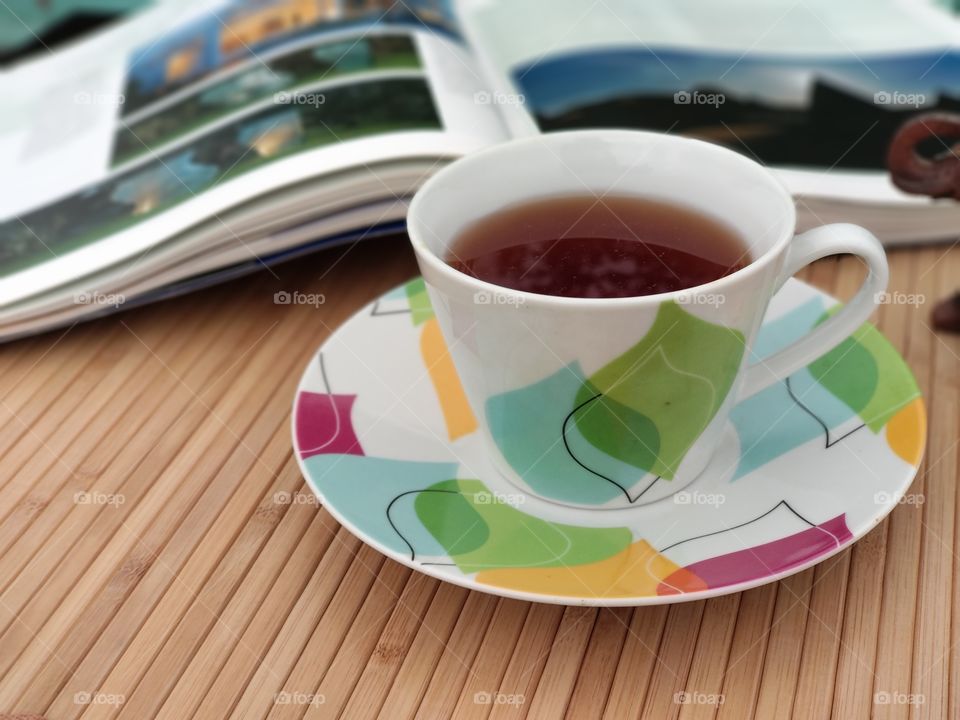 A cup of tea / coffee with a book