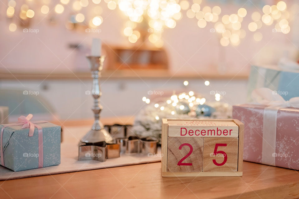 Christmas background with wooden block calendar with the date of December 25