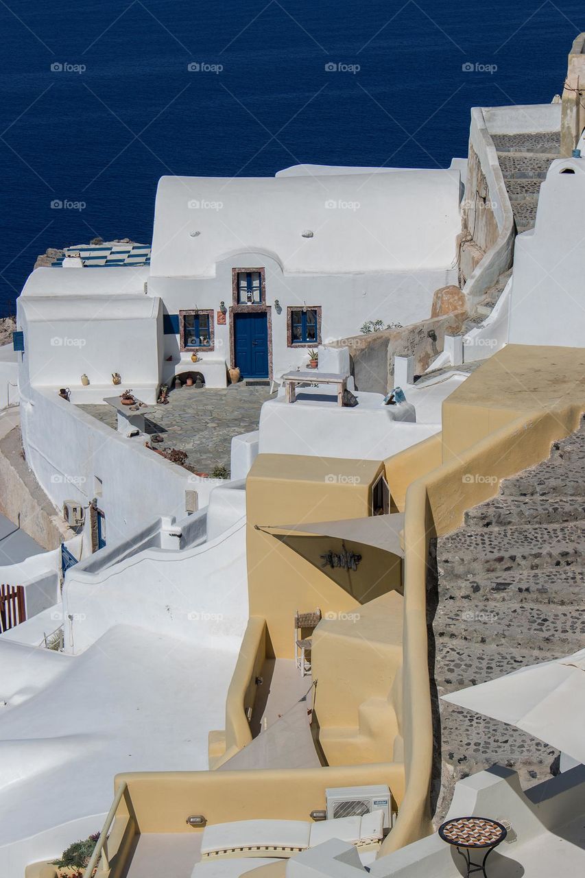 White houses above blue sea