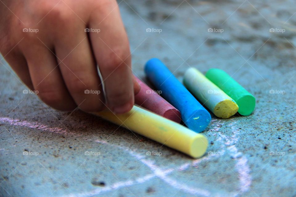 Colorful chalks on the pavement