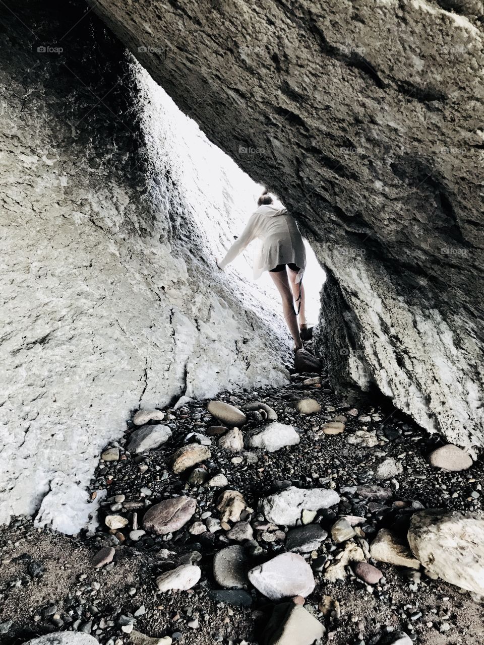 Rock formation, pathway. Cool lighting, relaxation.