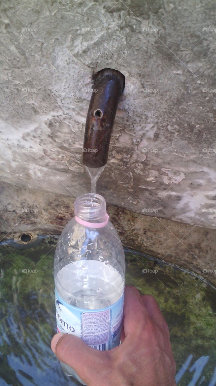 Me fill up drinking water from the streets of Rome it was a nice experience and beautiful memory .