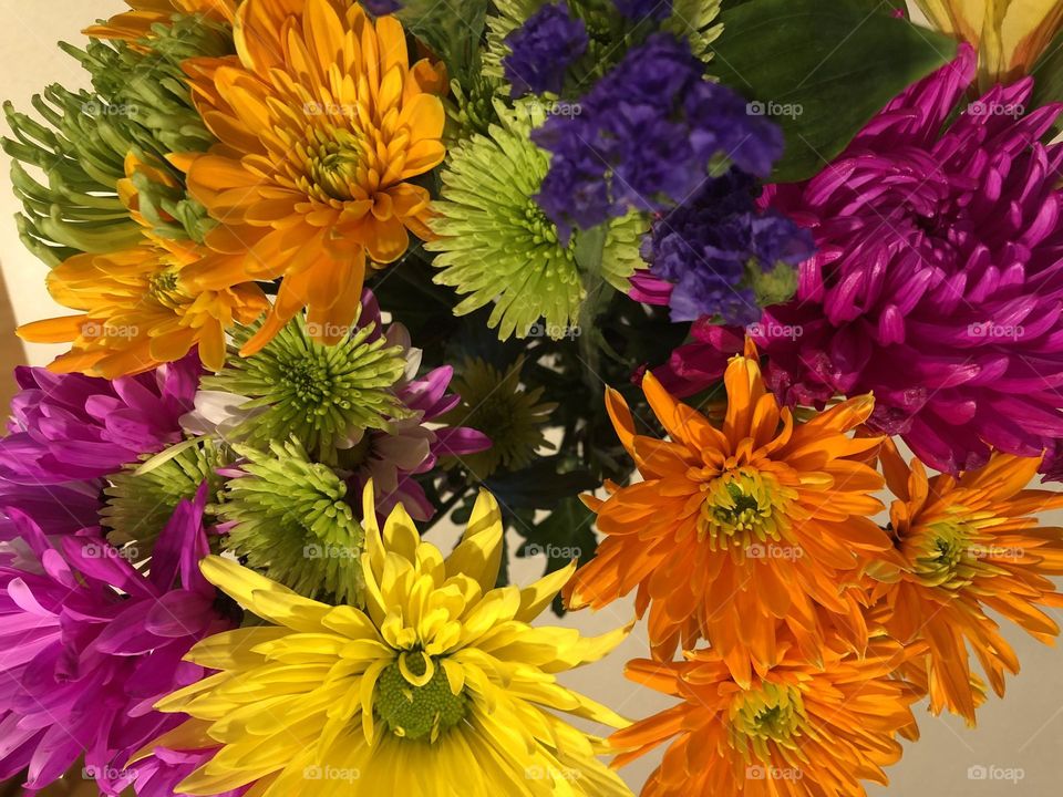 Beautiful bouquet of bright neon-colored flowers