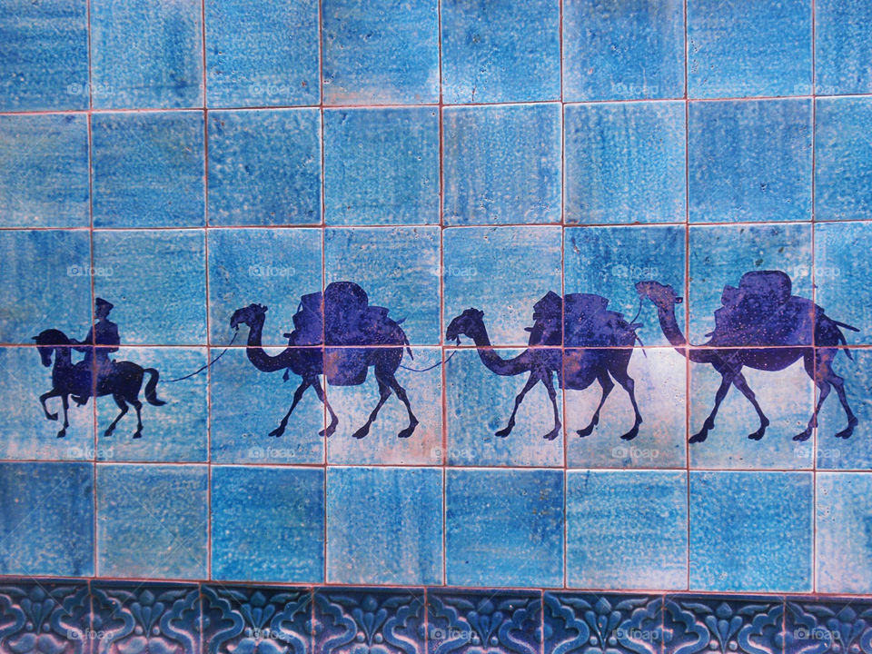 Purple camels on the blue wall