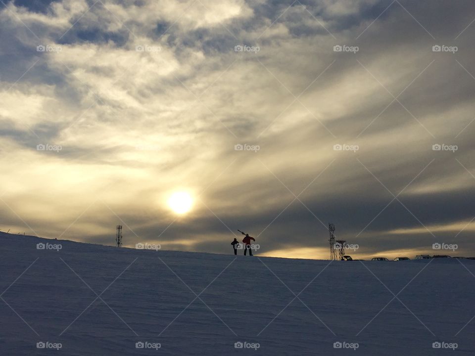 People in the sunset in winter