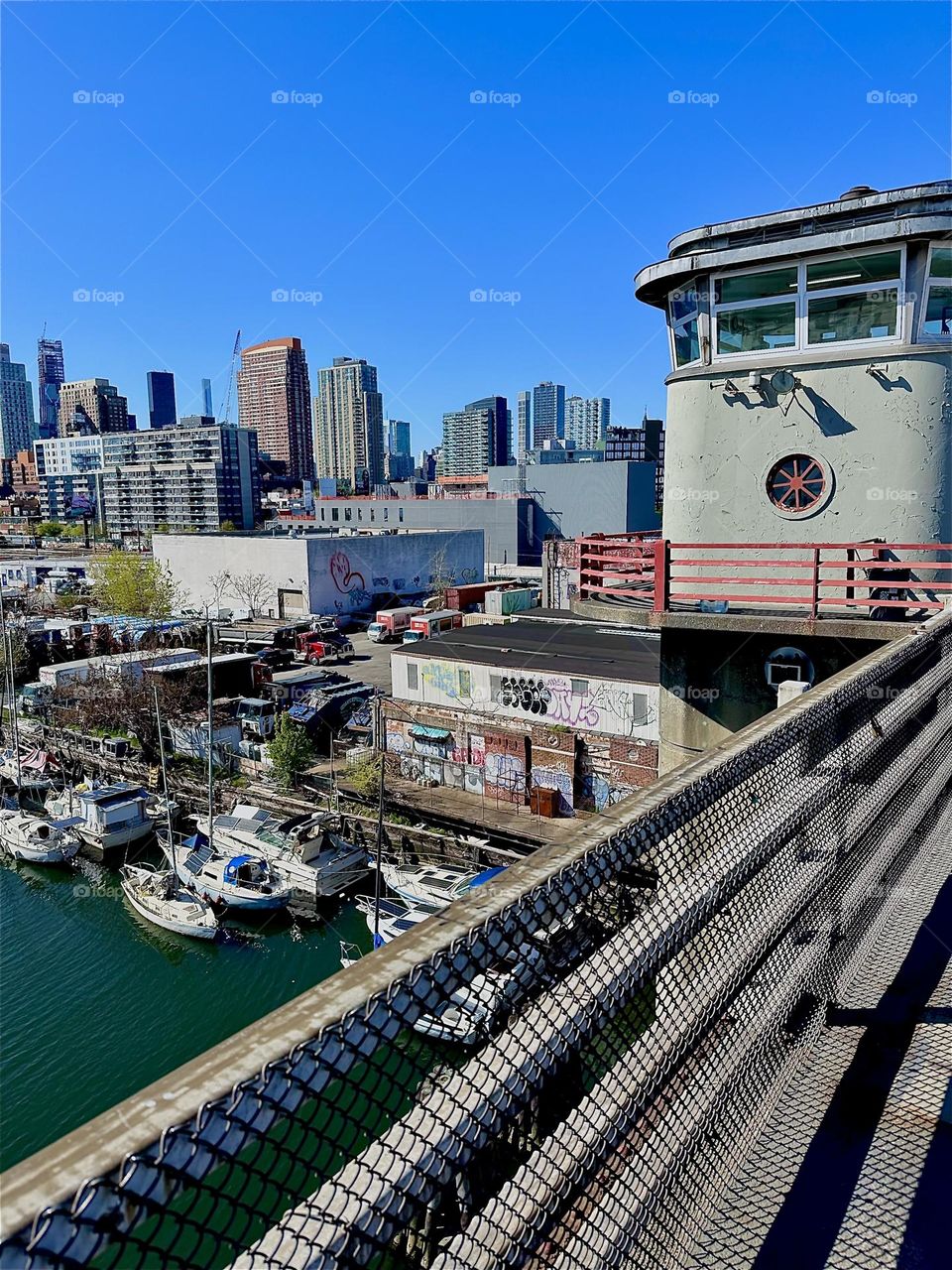 This is the “Pulaski Bridge” at “Newtown Creek” that connects LIC, Queens and “Greenpoint”, Brooklyn with view of its central outpost and watchtower. 2024. Hypnotic Productions