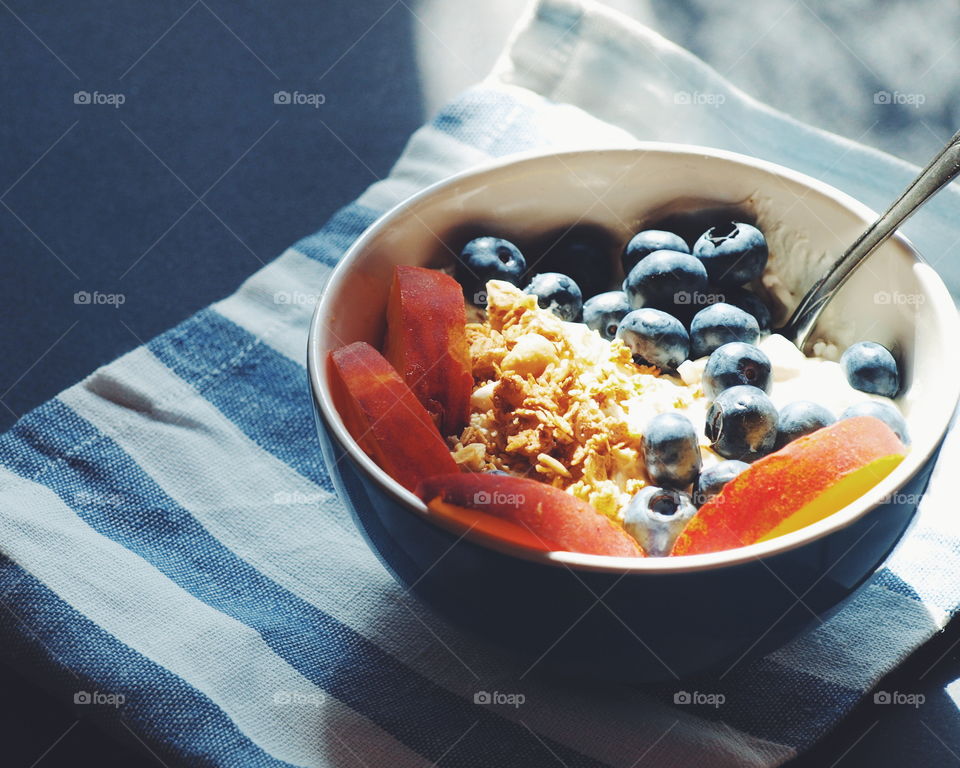 Healthy fruit and berries in smoothie bowl