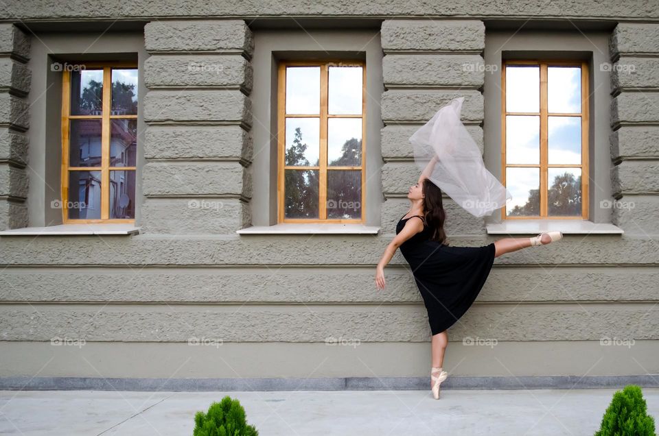 Young Female Ballerina Dancing Outside with Scarf