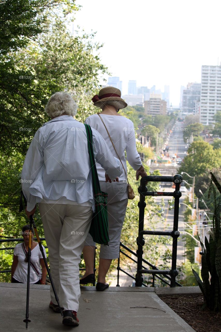 Two elderly ladies on a walk in the city