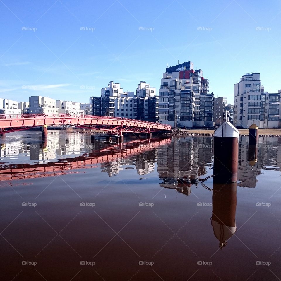 City towers and bridge reflect. City towers and bridge reflecting in the dock