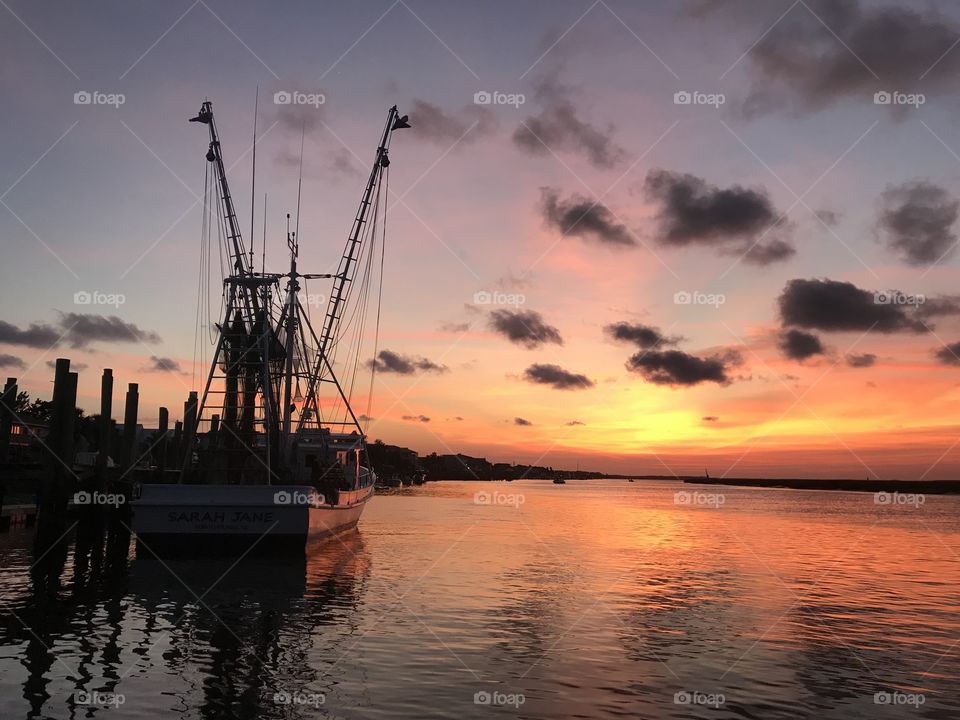 Shrimp boat at sunset