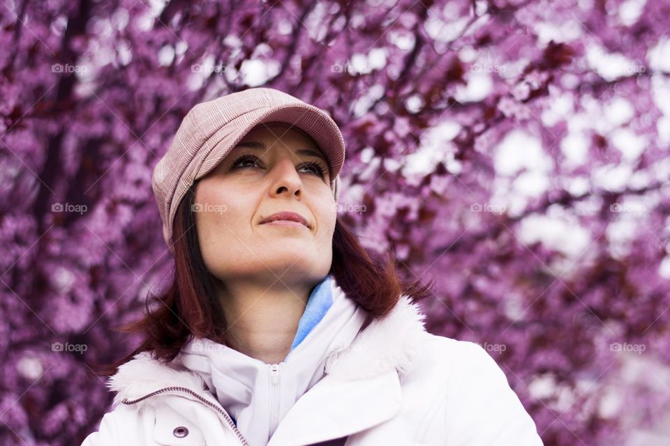 woman wearing hat enjoying colors of spring