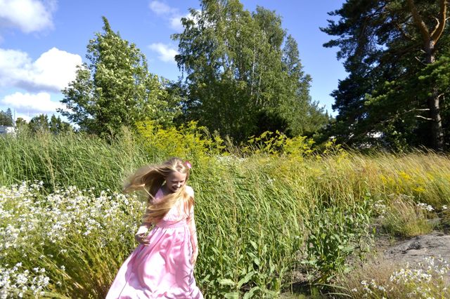 Girl standing near farm