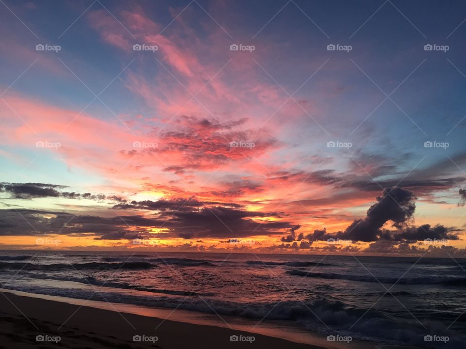 Brilliant sunset over the north shore of Oahu, Hawaii.