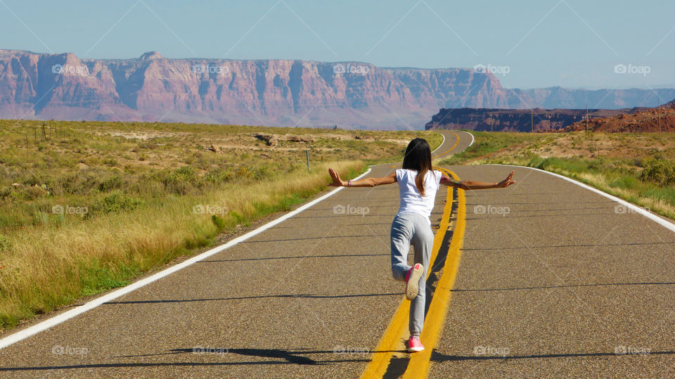 Model stands on the road.Utah roads