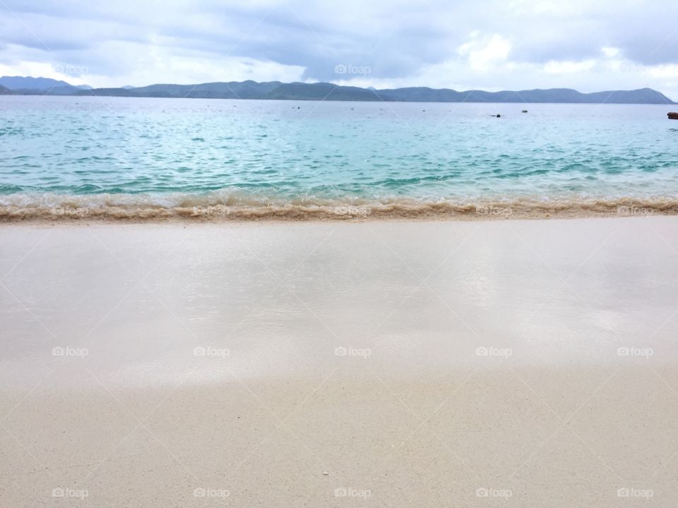 Relaxing scenery at white sand beach