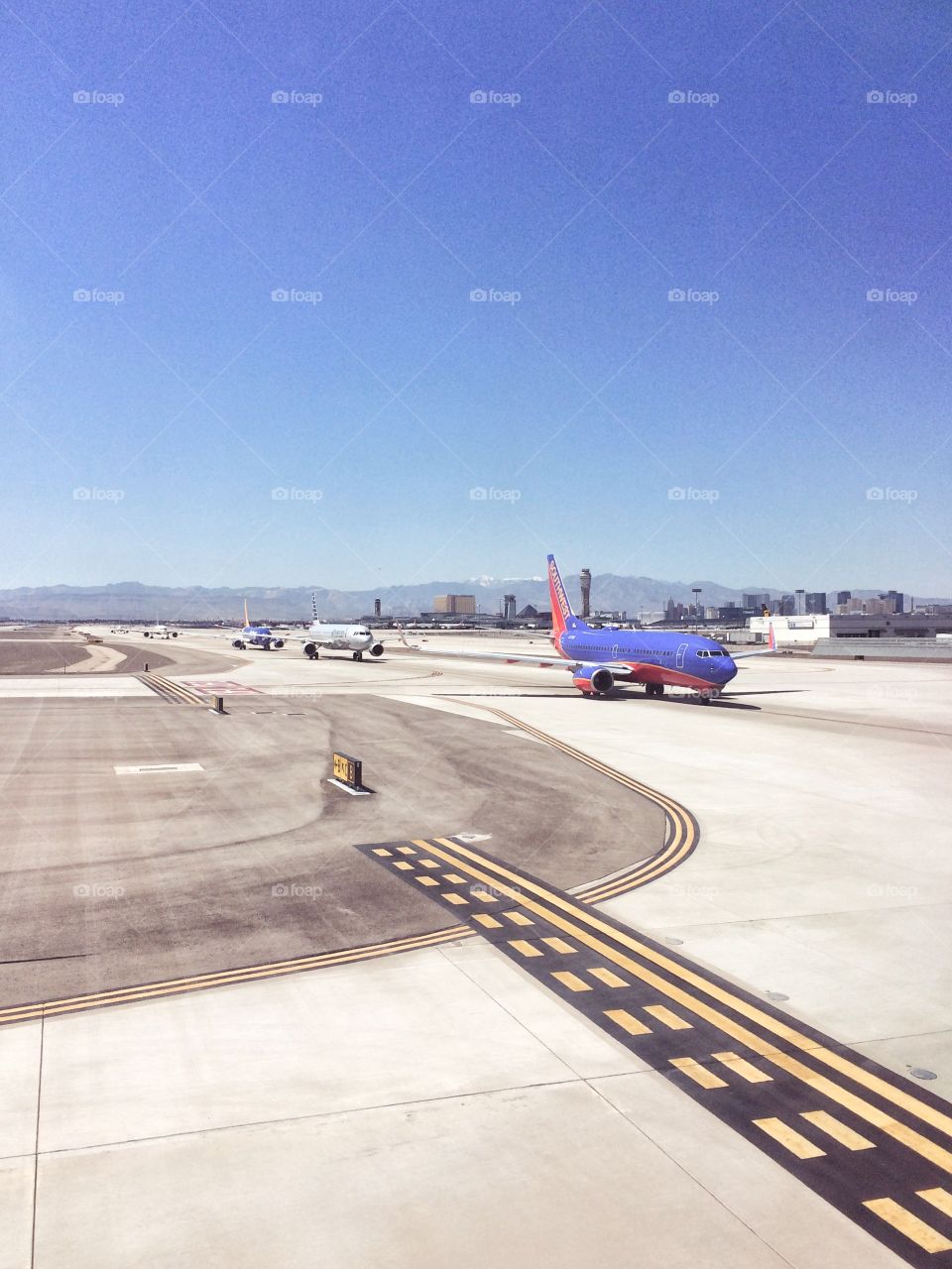 Airplanes taxiing on the runway in preparation for takeoff 