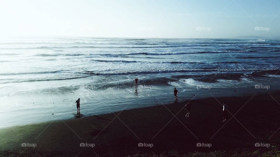 Group of people playing on beach