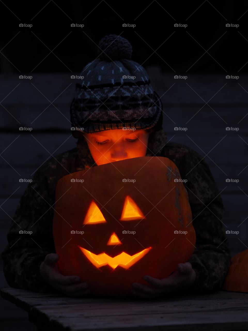 Cute little boy with Halloween pumpkin 