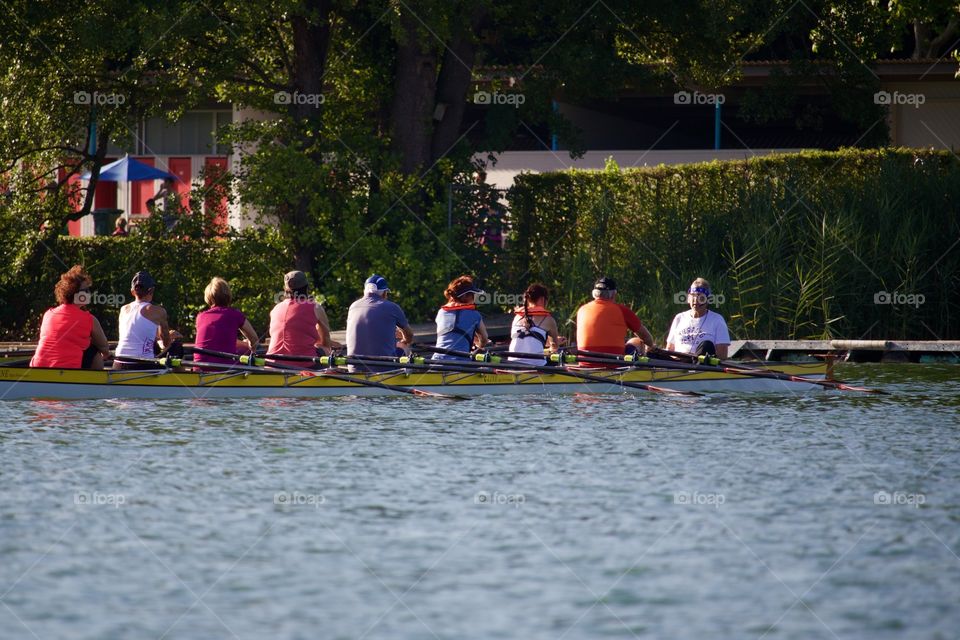 Group Of Adults Learning To Row 