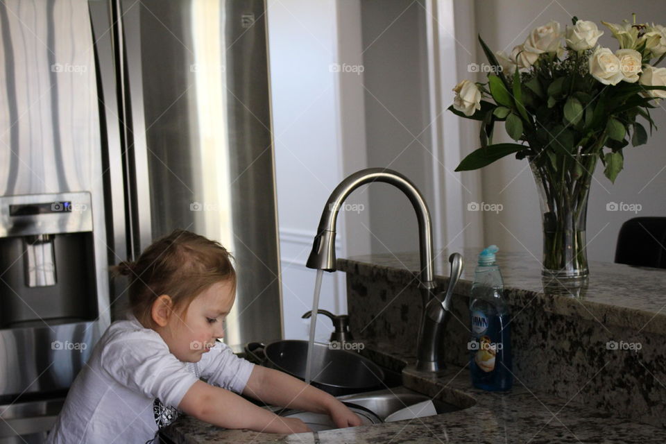 Girl washing dishes