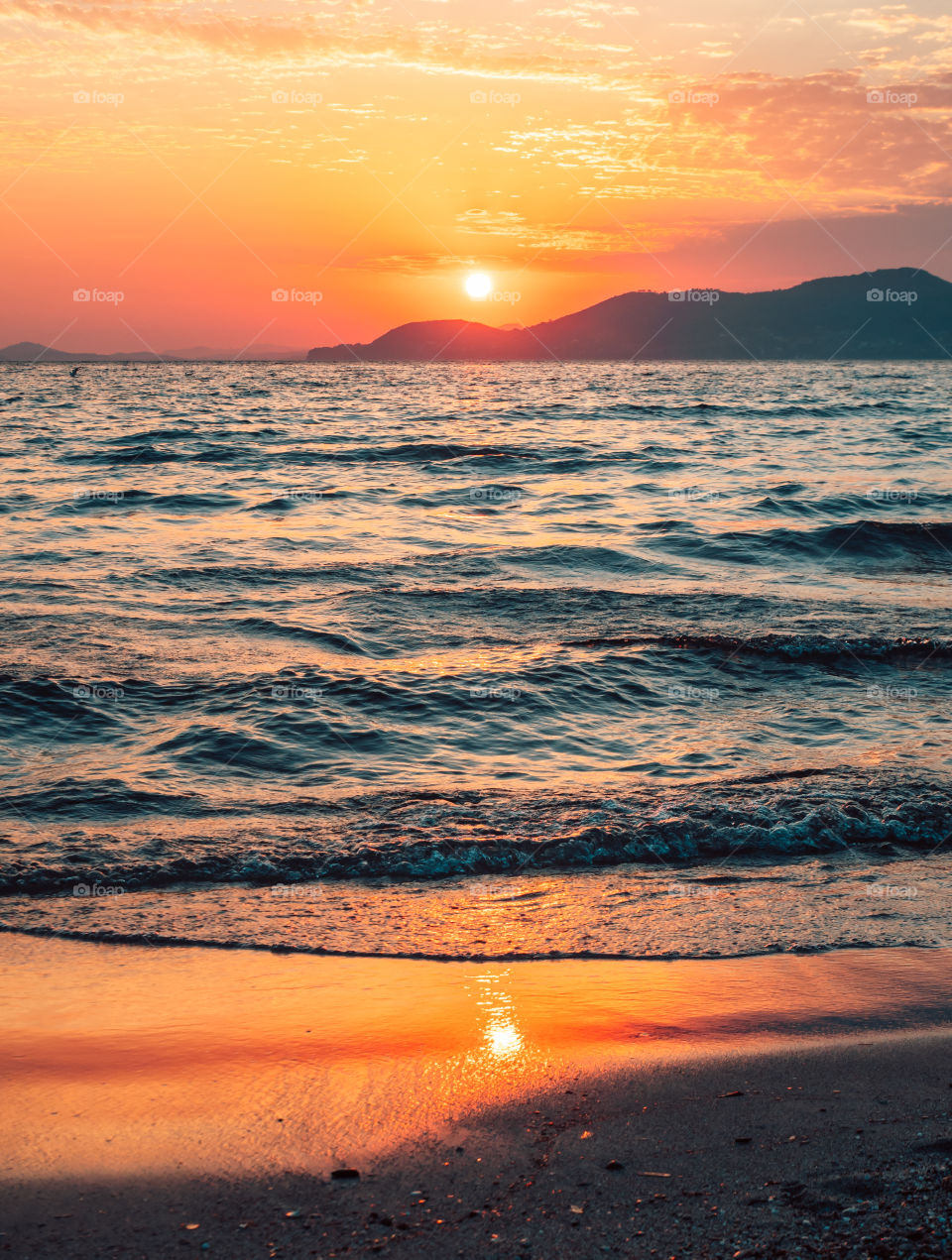 A double sun at Sunset on the Beach