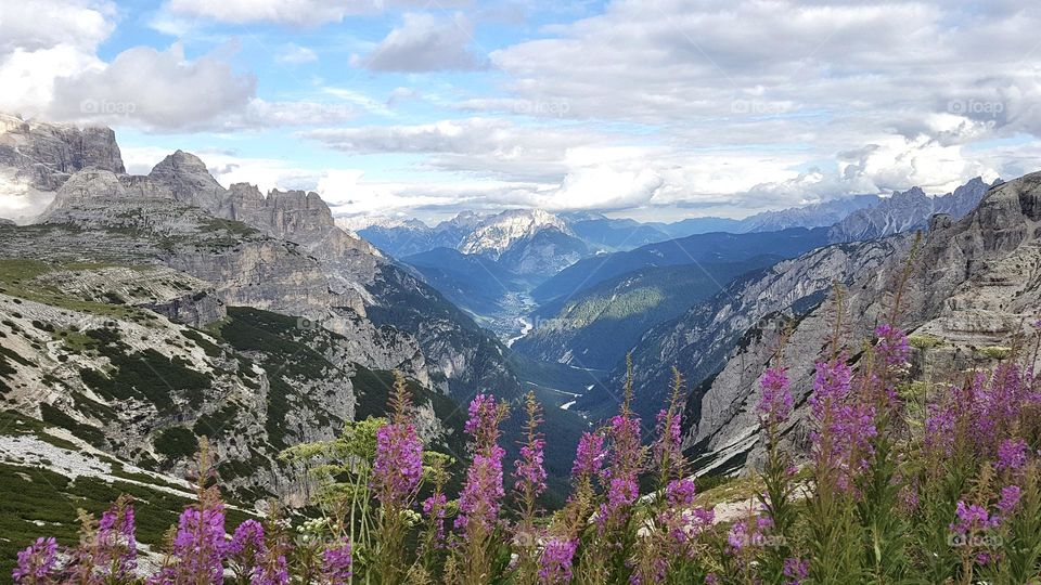 Landscape view of valley surrounded by mountains in the beautiful Dolomites Italy at summer 