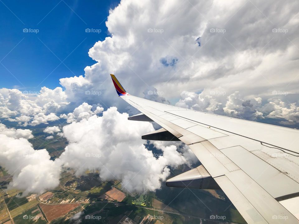 Beautiful white billowy clouds fill the crystal blue sky over Texas