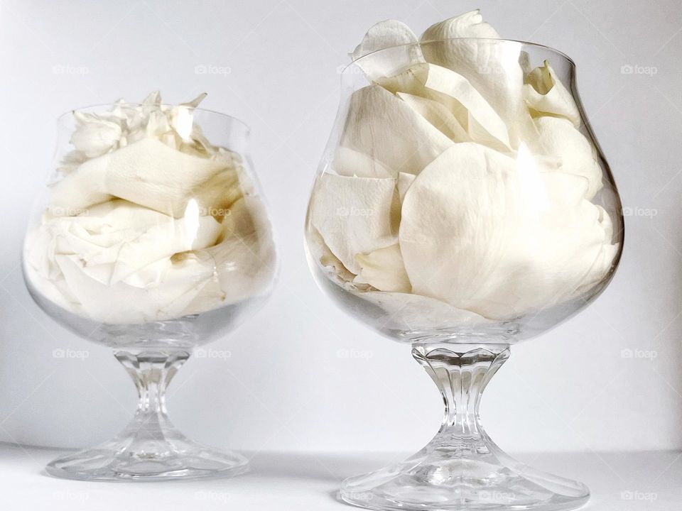 Glasses with rose petals