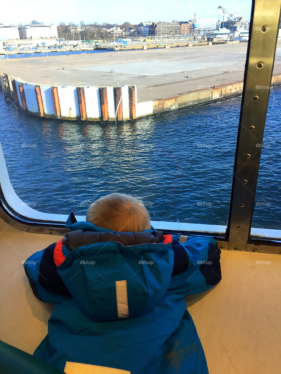 Boy looking out from the ferry window