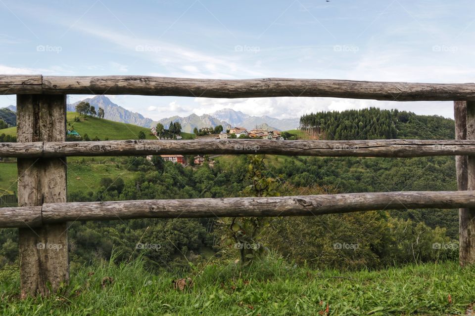 Alpine landscape behind the fence 