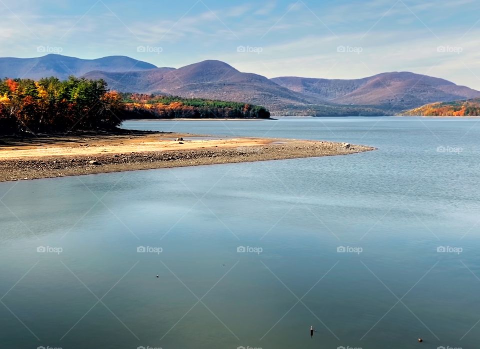 Mountains over a reservoir in autumn