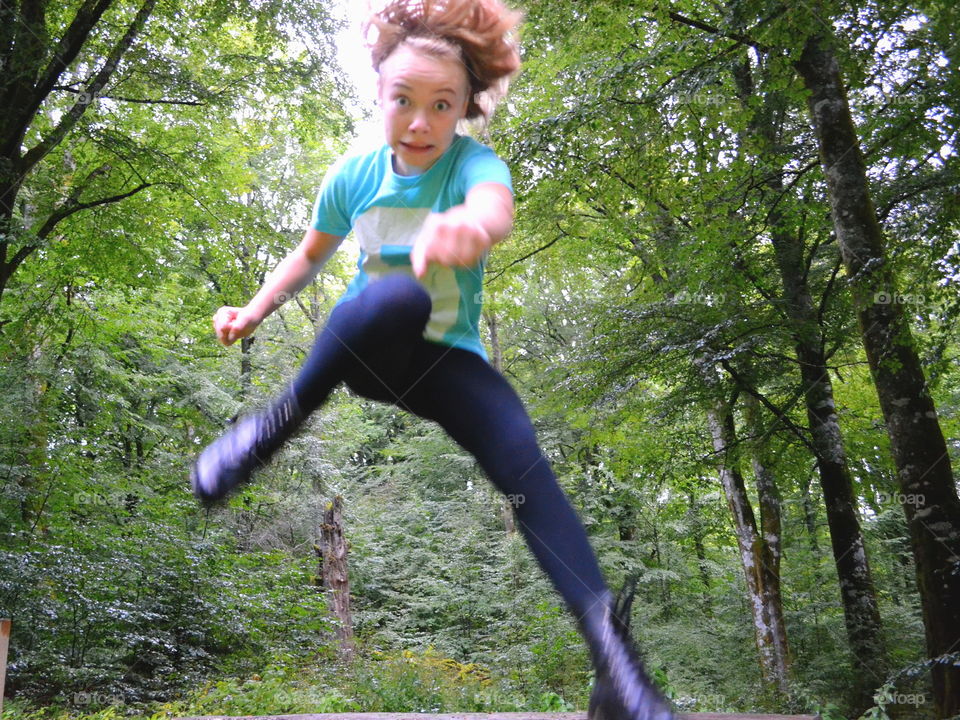 Girl jumping towards the camera