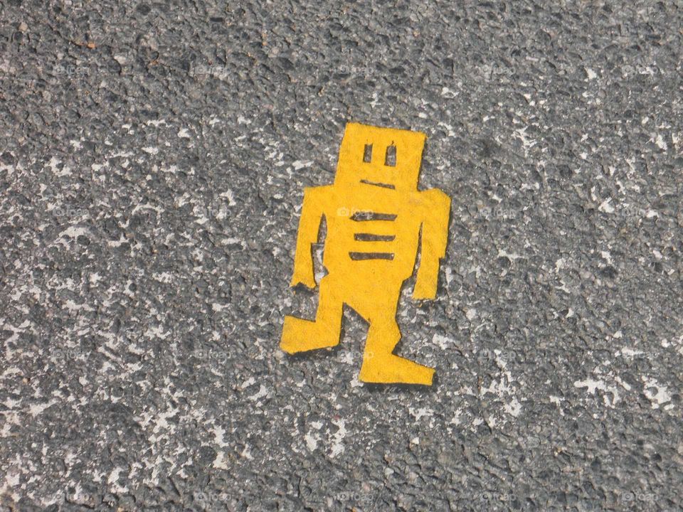 Goofy robot cutout on concrete