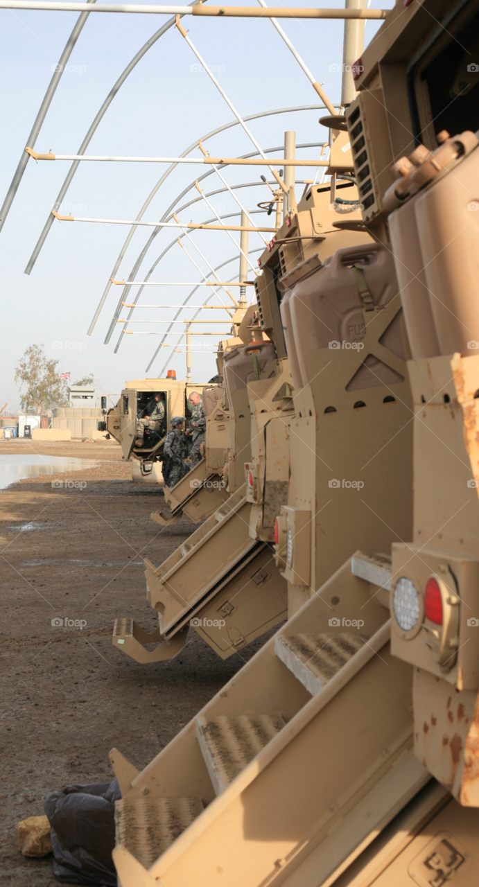 iraq patrol getting ready armored trucks. baghdad by camcrazy