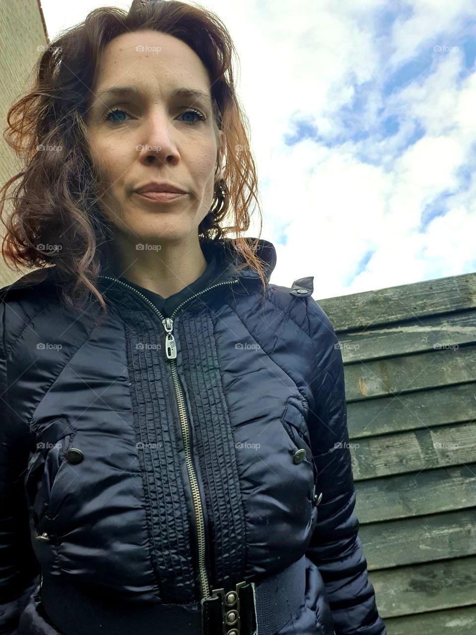 woman looks into the camera