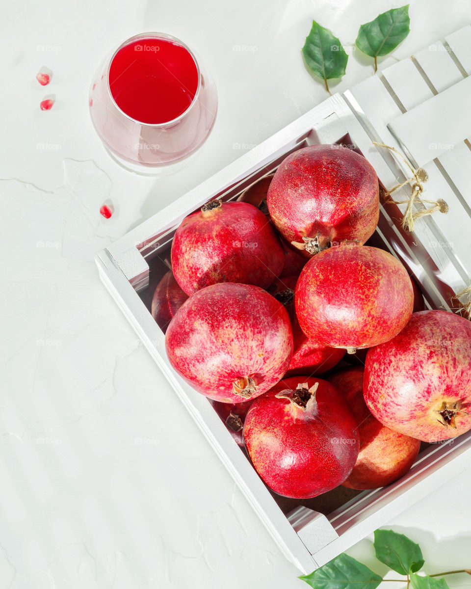 Locally grown, organic, citrus fruits is a nature Vitamin C. Immune boosting food. Summer, sunny, fruits composition with fresh oranges in a white box on a blue background with inspiration vitamin C