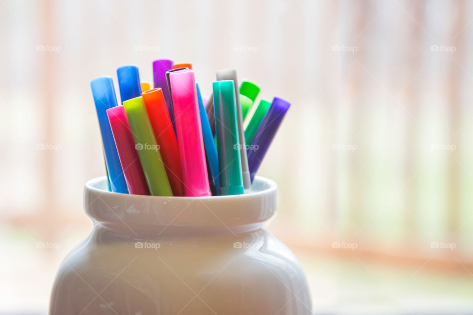 Colored maker pens in jar