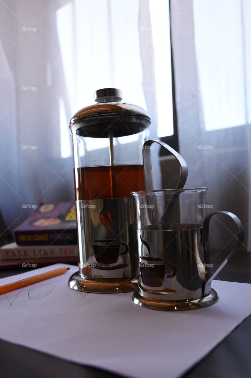 nothing feels refreshing like a reading a book as the sun rises while slowly taking a sip from your cup of coffee