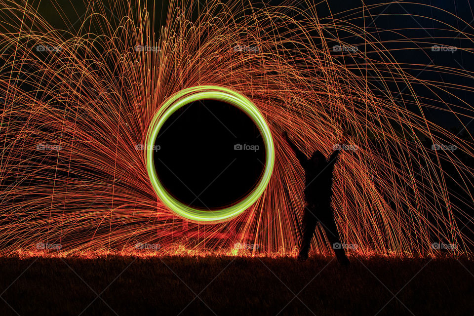 Person standing against firework