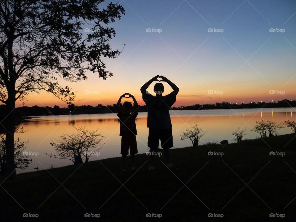 Sunset silhouette boys