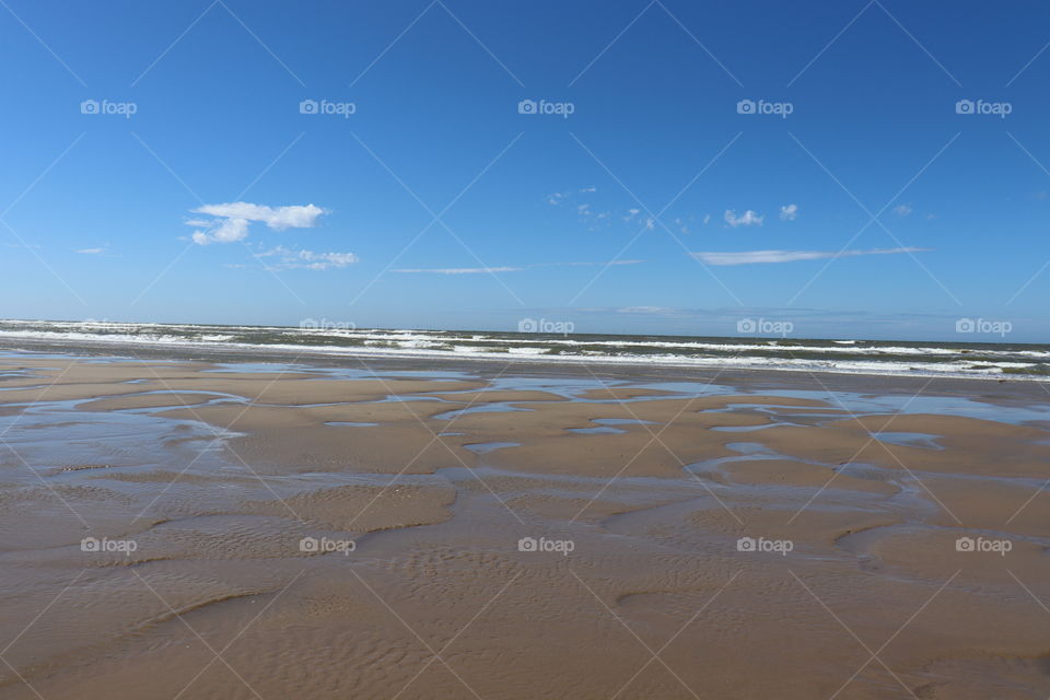 A sunny beach at low tide