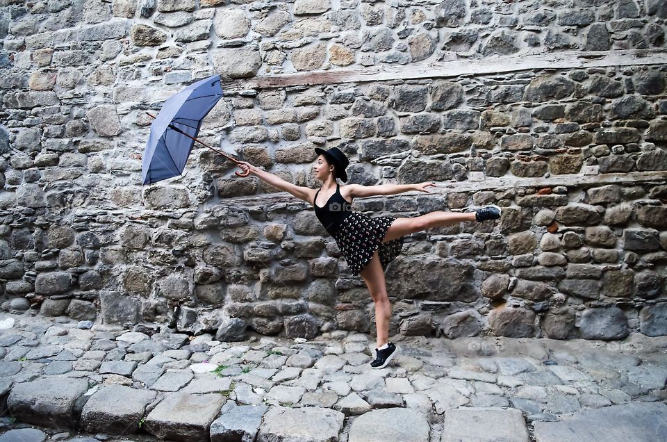 Young Female Ballerina Dancing Outside