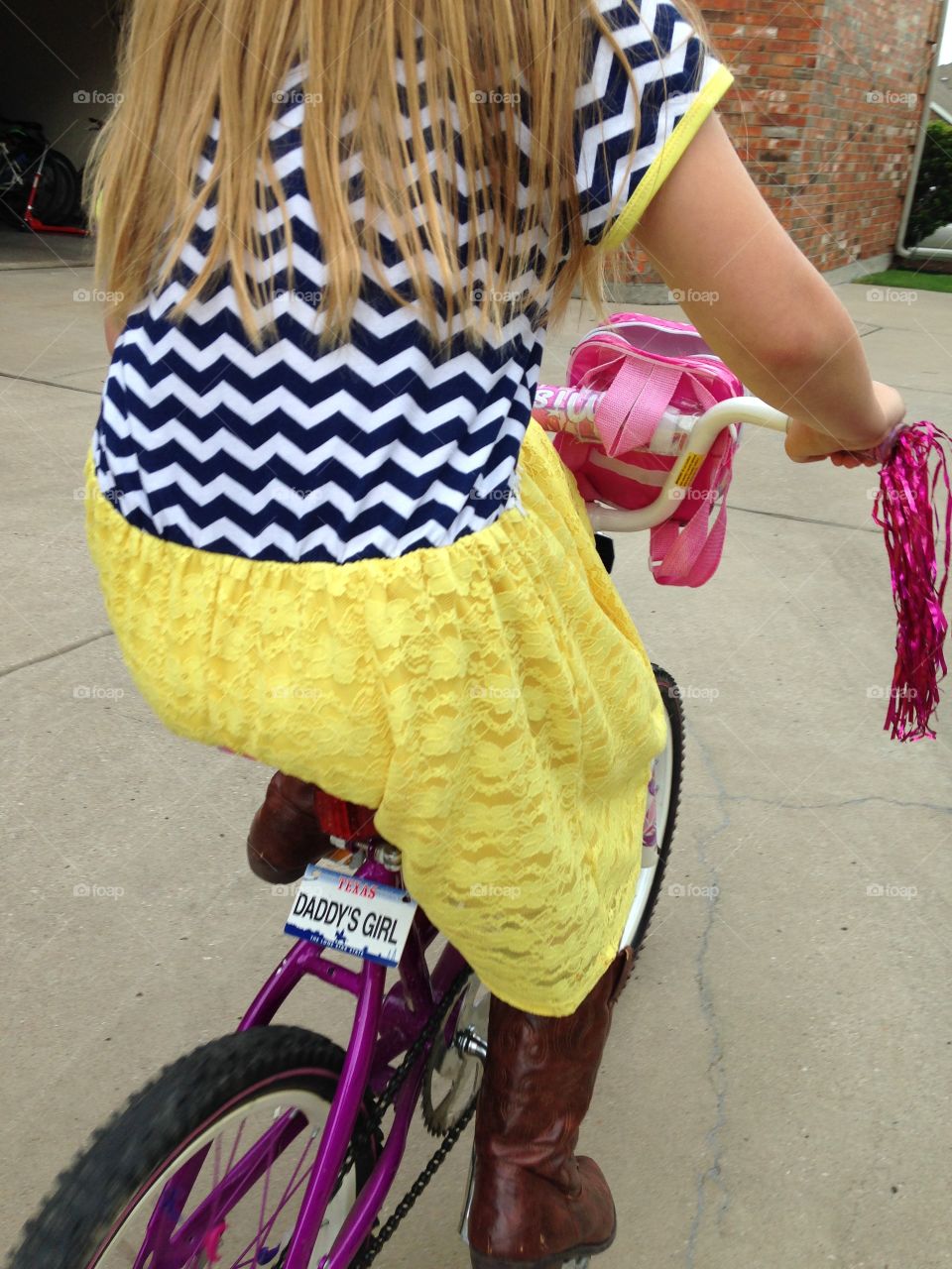 Daddy's girl. Girl riding bike