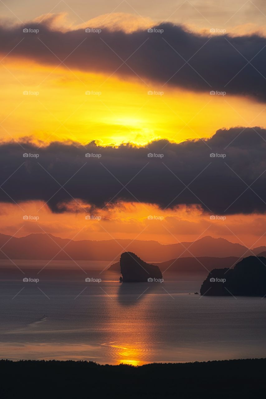 Golden time Golden scene of sunrise shade on island and sea in the southern of Thailand