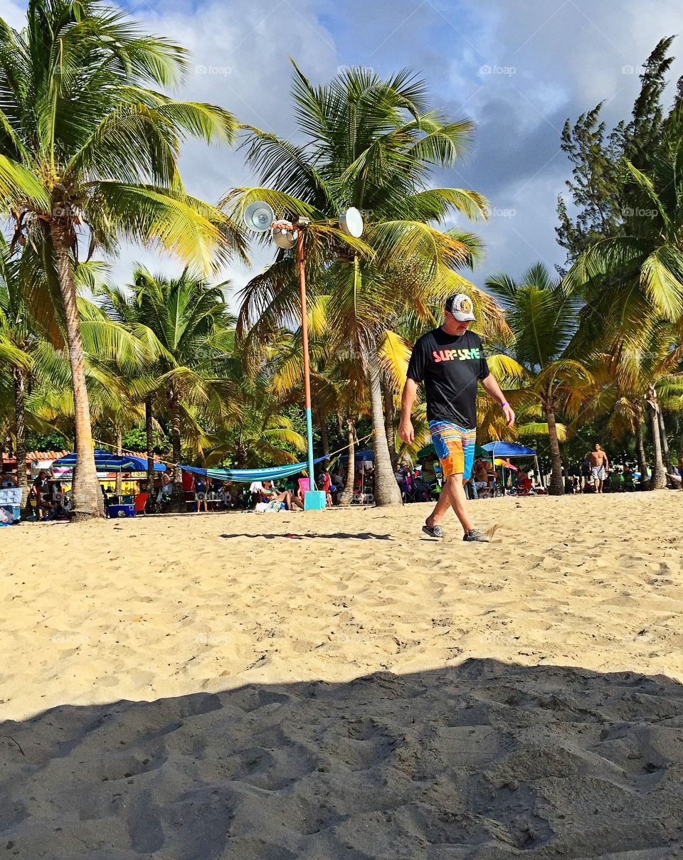 Man Walking on Beach