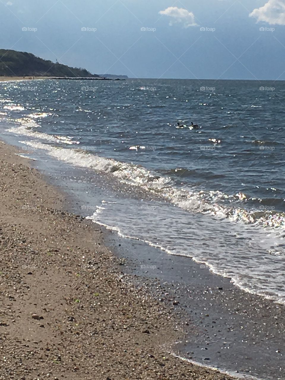 Ocean water waves on the beach.