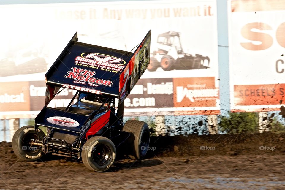 Outlaw Sprint Car Racing on a Dirt Track Slinging  Dirt