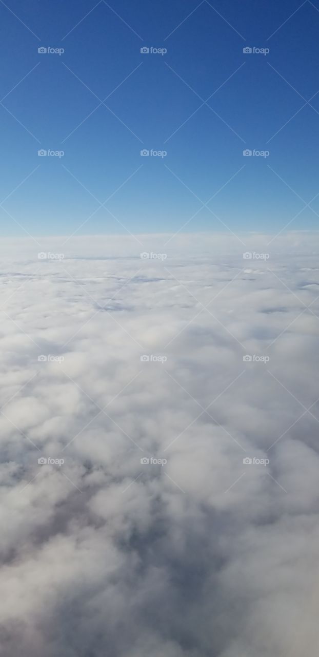 Amazing view of the sky and clouds while in an airplane, photo taken this year.